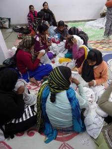 Women working together on chikan 